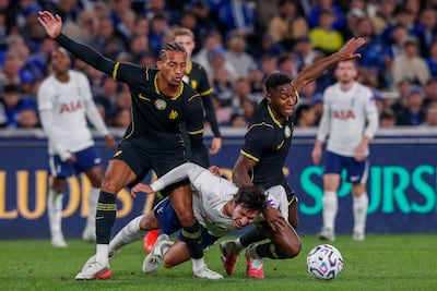 Chelsea's Joao Pedro, left, and Dario Essugo, right, vie for the ball with Tottenham's Sandro Tonali during a pre-season match. EPA