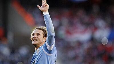 Three is the number: Forlan became third in his family to be a Copa America winner with his second goal and Uruguay's third in the final against Paraguay.