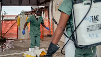 A medic working for Doctors Without Borders takes off their protective equipment at an Ebola treatment centre in the Democratic Republic of Congo. AFP
