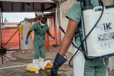 A medic working for Doctors Without Borders takes off their protective equipment at an Ebola treatment centre in the Democratic Republic of Congo. AFP