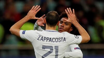 Willian celebrates scoring Chelsea's fourth goal with Davide Zappacosta. Peter Cziborra / Reuters