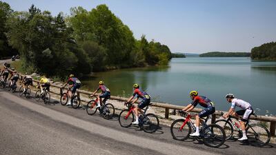 The peloton ride along the Barrage de Montbel. AFP