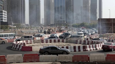 Traffic began building up as early as 8.30am in this small temporary roundabout at the back of Jumeirah Lakes Towers. Jeffrey E Biteng / The National