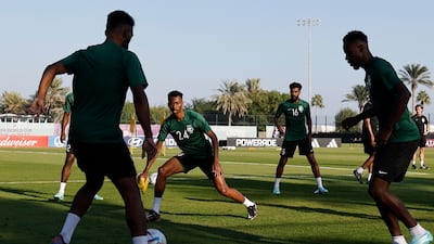 Saudi Arabia's Nasser Al Dawsari, Sami Al Najei and teammates attend a training session at the Sealine Training Site. AFP