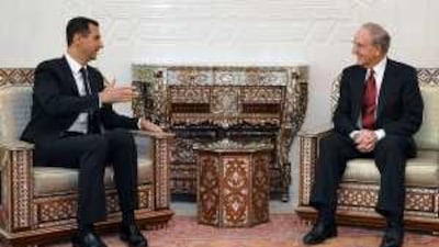 The US envoy George Mitchell, right, told the Syrian president, Bashar Assad, that Damascus has an "integral role" to play in peace talks.