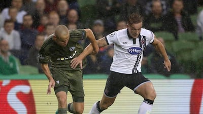 Dundalk's John Mountney, right, shown against Legia Warsaw in the Champions League last week. Niall Carson / PA / AP / August 17, 2016