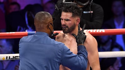 Referee Kenny Bayless counts to Jose Ramirez after the American was knocked down by Josh Taylor. AFP
