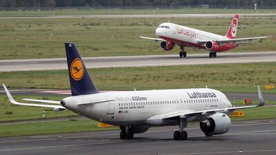 An Air Berlin jet takes off behind a taxiing Lufthansa plane at Duesseldorf Airport, Germany. Lufthansa said it was signing a contract to buy 'large parts' of bankrupt carrier Air Berlin. Friedmann Vogel/EPA