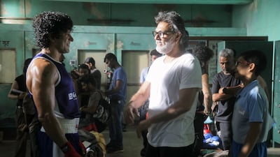 Farhan Akhtar and 'Toofaan' director Rakeysh Omprakash Mehra on set.