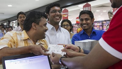 Chennai Super Kings fan Natarajan Suresh is first in line to get his hands on seven IPL match tickets. Mona Al Marzooqi / The National