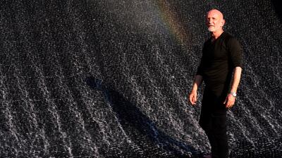 Mark Fuller, chief executive of Los Angeles firm WET, watches Surreal, a water feature designed by his company. AP Photo