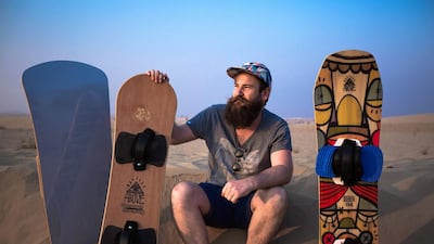 Simon Hunt makes and shapes sandboards for friends, but he has won a contract to start selling them in the UAE. Middle East artists will help design the graphics, giving them a local look. Victor Besa for The National