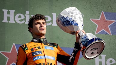 Lando Norris celebrates after winning the Dutch Grand Prix. EPA