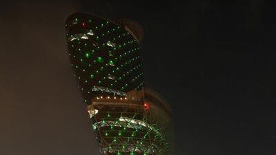 Capital Gate is alight with green to mark Saudi National Day. Wam