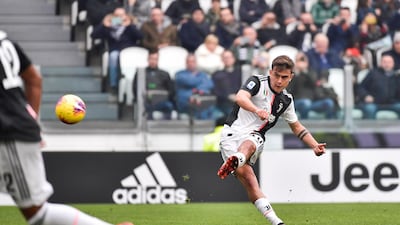 Juventus' Paulo Dybala scores the opening goal against Brescia at the Allianz Stadium on Sunday. AP