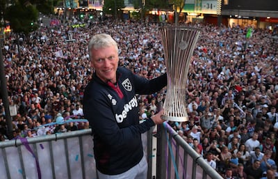 David Moyes holds the Conference League trophy he won with West Ham. AFP