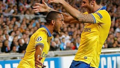 Theo Walcott, left, sent Arsenal in the lead just near the hour mark. AP Photo