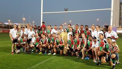 Abu Dhabi Harlequins pose with the West Asia Cup trophy. Courtesy Mike McFarlane