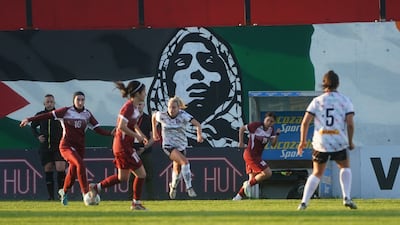 A mural incorporating the flags of Palestine and Ireland forms a backdrop to the friendly. PA