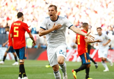 Russia's Artem Dzyuba celebrates scoring their first goal against Spain. Reuters