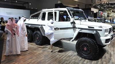Visitors check out the new Mercedes-Benz G63 AMG 6x6 on display at the Dubai International Motor Show. Charles Crowell / The National