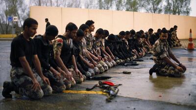 Members of the Saudi security forces pray before the start of a military parade in preparation for the annual haj pilgrimage in the holy city of Mecca. REUTERS / Ibraheem Abu Mustafa