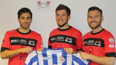 Pontypridd Town players hold a Deportivo La Coruna shirt after their friendlty match. Photo: Pontypridd Town