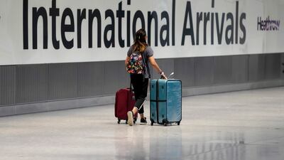 A passenger arrives at Heathrow Airport's Terminal 5. AP