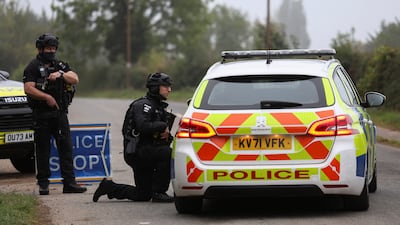 Police officers stand guard as roadblocks remain in place near the RAF Fairford airbase in Gloucestershire. Reuters