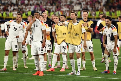 Players of Germany celebrate together after winning their game against Denmark in Dortmund. EPA