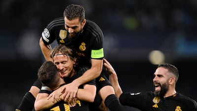 Real Madrid players celebrate after Alex Meret of Napoli scored an own goal. Getty
