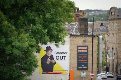 A campaign poster for Workers Party of Britain candidate George Galloway adorns a house in the Batley and Spen constituency. Getty.