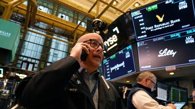 Traders on the floor of the New York Stock Exchange. US stock markets closed higher while Treasury yields rose sharply on Tuesday. AFP