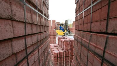 Workers operating in the Bildco cement factory in Mussafah. Mona Al Marzooqi/ The National