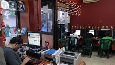 Young Lebanese surf the web at an internet cafe in Beirut. Across the Arab world, there are more than 55 million Facebook users. Nabil Mounzer / EPA