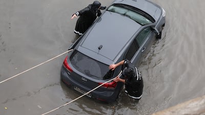 Civil Protection helps a person whose car is stuck in floodwaters in Tunis, Tunisia, 20 January 2026. Tunisian authorities announced that the floods that struck the country have claimed three lives. The Tunisian Observatory of Meteorology and Climate has warned residents of several governorates of a high risk of flooding. EPA / MOHAMED MESSARA