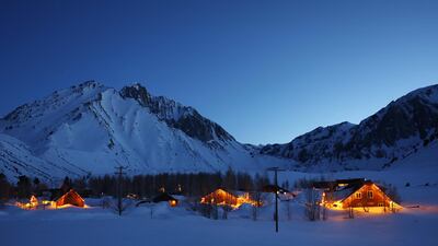 Cabins partially buried in snow in the Sierra Nevada mountains, California, amid late winter storms. AFP