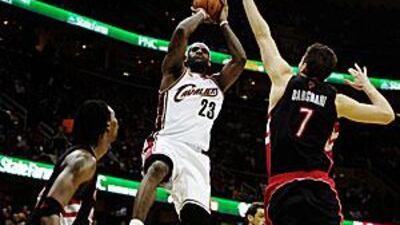 Cleveland Cavaliers' LeBron James, in white, was too hot for the Toronto Raptors to handle.