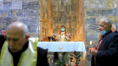 Father Ammar Altony Yako leads prayers as Christians attend mass at the Grand Immaculate Old Church in Qaraqosh, the largest church in Iraq. Pope Francis is scheduled to visit on Sunday as part of his tour. Reuters
