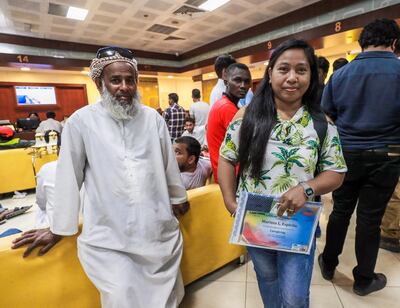 Residents who have been trying to take advantage of the amnesty wait patiently at the Tasheel Centre in Abu Dhabi. Victor Besa/The National