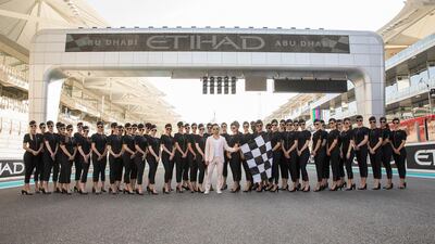 Designer Prabal Gurung with the Etihad Grid Girls one the track. Courtesy Etihad