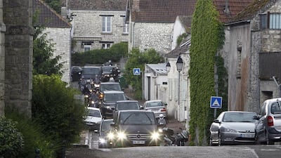 The cars of Kim Kardashian, Kanye West and their guests arrive at the entrance of the Wideville Castle, in Davron, 35 miles west of Paris on May 23, 2014. Francois Mori / AP photo