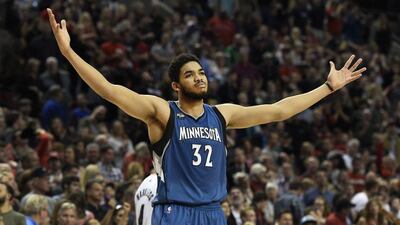 Minnesota Timberwolves center Karl-Anthony Towns celebrates after hitting the game-winning shot in an NBA basketball game against the Portland Trail Blazers in Portland, Ore., Saturday, April 9, 2016. The Timberwolves won 106-105. (AP Photo/Steve Dykes)
