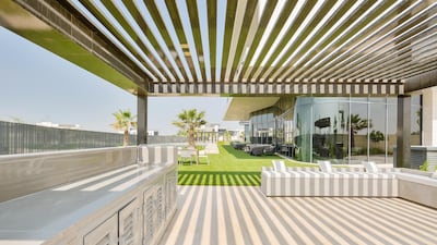Cook and dine al fresco, with this outdoor kitchen. Courtesy Luxhabitat Sotheby's International Realty
