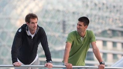 Andy Murray, left, the 2009 Mubadala World Tennis Championship winner, took some time from practice to chat with world No 1 Novak Djokovic, who won the previous Mubadala.