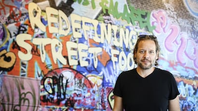 From top: Mohamad Bitar, the founder and managing director of Just Falafel, before it was rebranded as JF Street Food, at an outlet in Dubai Marina. Sarah Dea / The National