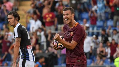 AS Roma's Edin Dzeko, right, celebrates after scoring during the Italian Serie A match against Udinese at Stadio Olimpico in Rome, Italy, Sunday, August 20, 2016. Alessandro Di Meo / EPA