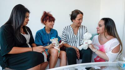 Left to right, Aya Baker, Sarah Hall, Alexandra Sullivan and Melissa Lindley all lost infants in childbirth. Victor Besa / The National