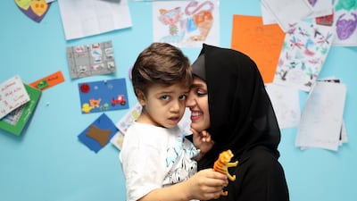 Zahia bin Zayed and her son three-year-old Mohamed Hedi, at the Dimensions Centre. Chris Whiteoak / The National