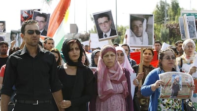 Faris (left), the son of the Syrian Kurdish opposition leader Meshaal Tamo, who was assassinated in Syria the previous day, gathers with supporters outside the Kurdistan parliament in the Iraqi Kurdish city of Arbil, as his father's funeral takes place in the northeastern Syrian city of Qamishli. Safin Hamed / AFP